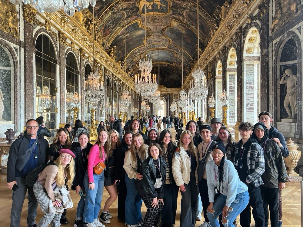 GoXL students and trip leaders in the Hall of Mirrors at Versailles