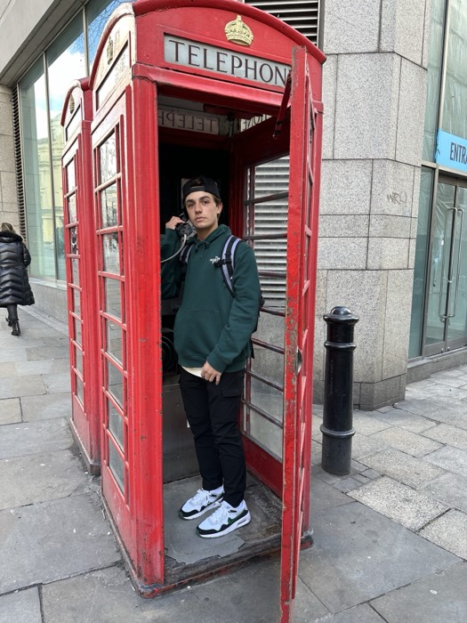 A GoXL student in a red London phone box